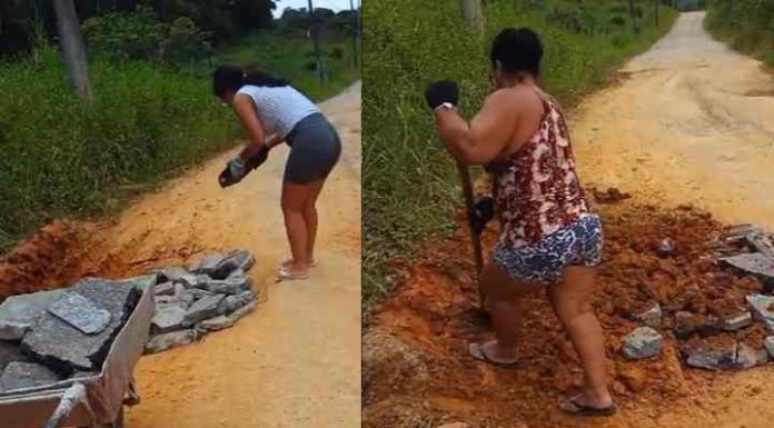 Mãe e filha metem a mão na massa para consertar buraco na Rua Laci Simão Corrêa em Penha