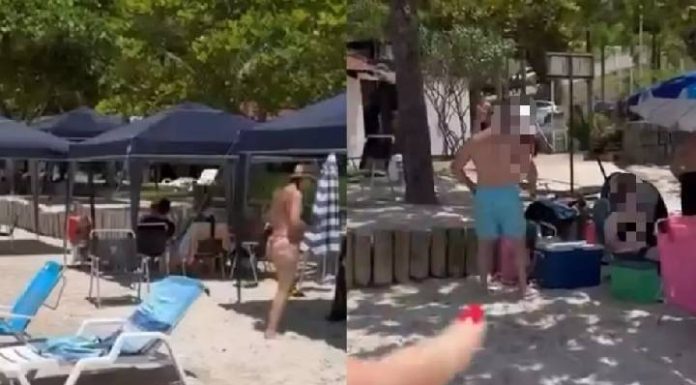 ‘Quero ver quem me tira’: mulher enfrenta condomínio acusado de expulsar pessoas de praia em SC