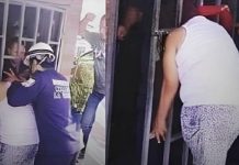 Mulher fica com cabeça presa em portão ao tentar espiar casa de vizinha
