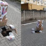 Moradores improvisam sinalização com caixas e sacolas para alertar sobre buracos em rua de Piçarras
