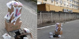 Moradores improvisam sinalização com caixas e sacolas para alertar sobre buracos em rua de Piçarras
